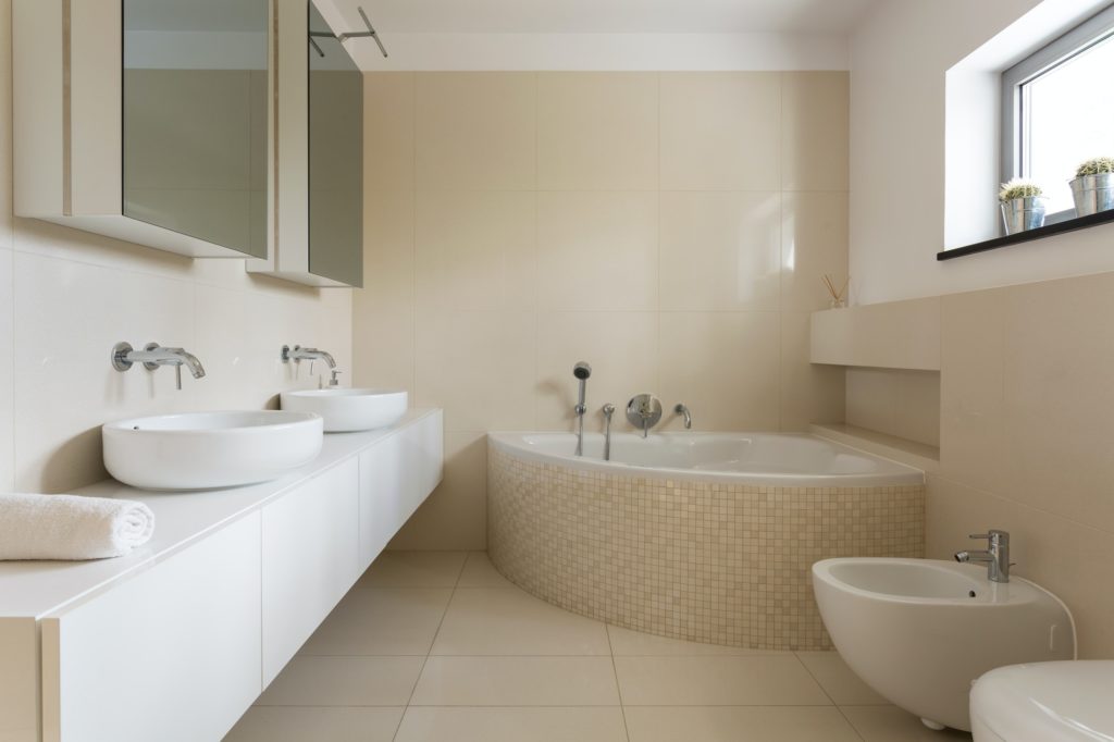 Creamy bathroom with minimalist furniture