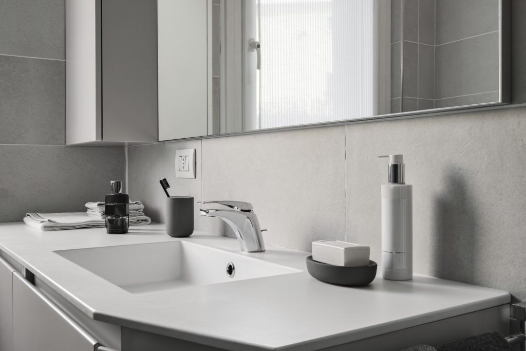 Interiors of the Kitchen and the Bathroom in a Modern Apartment